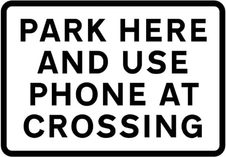 Place where drivers of large or slow, or long low vehicles should park near a level crossing while contacting the signal operator