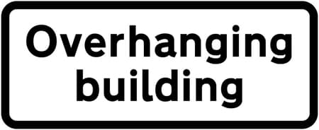 Reduced headroom over part of road due to overhanging building ahead