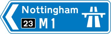 Direction to a motorway at the junction shown, indicating route number and destination reached along the motorway