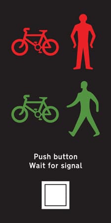 Near side light signals and instructions for pedestrians and cyclists at a Toucan crossing